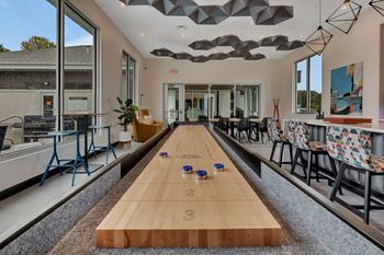 Shuffleboard table in clubhouse lounge area
